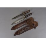 Two British WWII jungle/survival knives, both similar in design, one with a slightly wider and