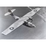 A black and white photograph of a WWII RAF Flying boat, possibly RAF Catalina, together with a