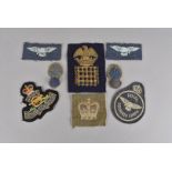 A vintage military cloth badge with eagle on crown and portcullis, together with a selection of