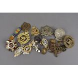 A large collection of buttons and badges, including The Canadian Scottish Deas Cath, St John