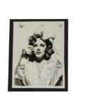 Judy Garland, An 8"x10" black and white photograph on ivory paper, signed with dedication to '