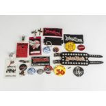 Judas Priest, a mixed collection including laminate passes, pin badges, cloth patches, leather