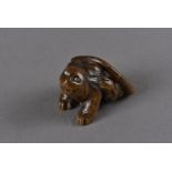 A Meiji period Japanese wood carved signed netsuke, modelled as a water rat, with bone inset eyes,