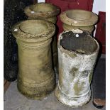 Four early 20th century chimney pots, the stoneware examples of tapered form, three 64 cm high,
