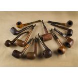 A collection of British briar estate pipes, including a Cavalier 995 sitter with logo marked stem, a