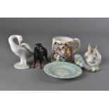 A Lladro rabbit and branch, together with a Lladro goose, a Beswick Rottweiler, a coronation mug