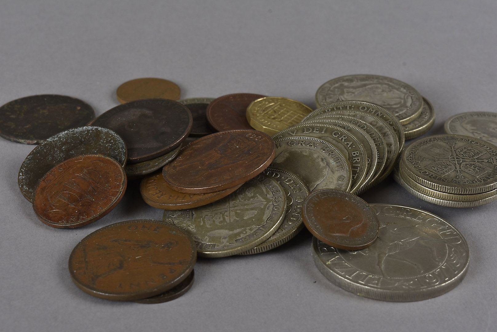 A collection of British and world coins, including twenty George V half crowns, various pre 1947