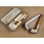 A cased meerschaum companion set, comprising pipe, cigarette and cheroot holder in an Echt Bernstein