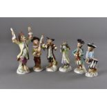 A six piece Meissen style monkey band, including a conductor, piper, flautist, piper, drummer, and