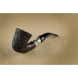 A Viking Classic bent shaped pipe, the rusticated bowl, with white metal band, stamped Hand Made