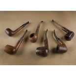 Six G.W Simms briar estate pipes, including one sandblasted, with smooth sections, and curved