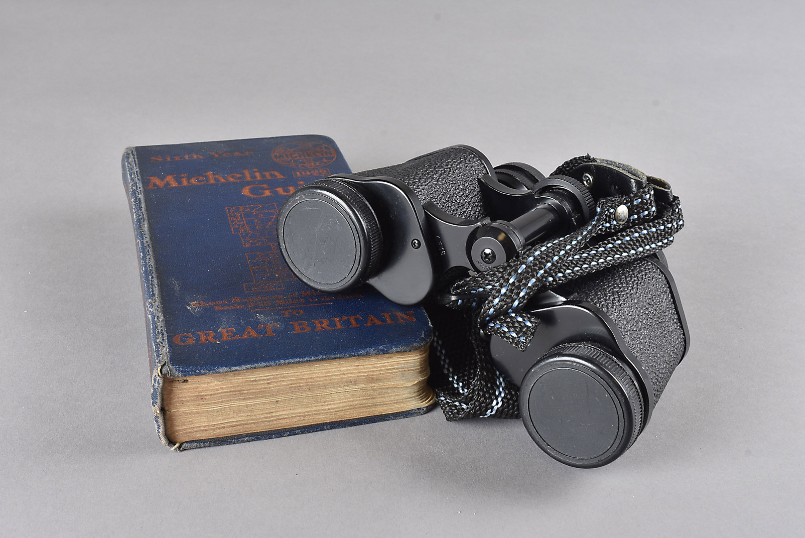 A pair of Cadet 8 X 10 field binoculars, in a leather case, together with a pair of 8 X 20 chromed