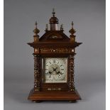 A Victorian walnut mantle clock, with eight day movement striking on coiled rod, the dial and