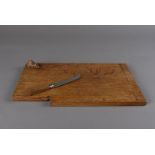 A Ben Oxley of Windsor oak cheese board, of rectangular shape with carved mouse to one corner and