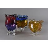 Three Italian glass vases, including an amber footed example 15 cm high, another in red and purple