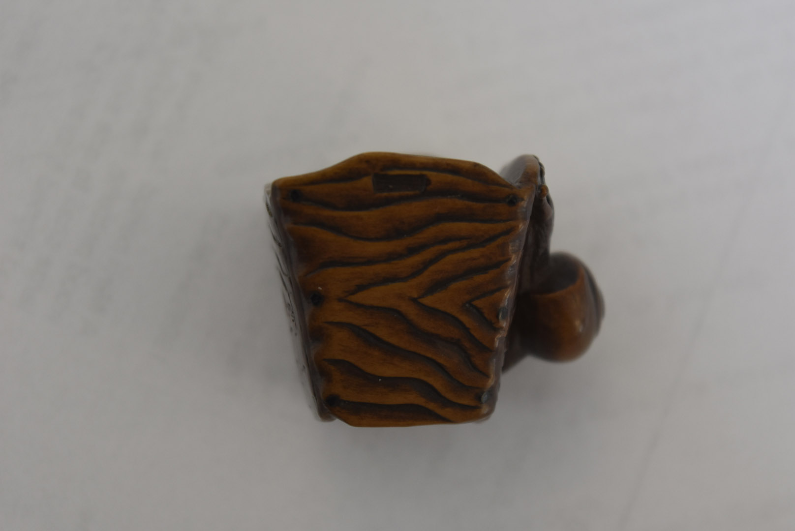 A Meiji period Japanese signed carved wood netsuke, modelled as a gong with large snail to one - Image 4 of 6