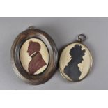 Two 19th century silhouettes, one of a Regency gentleman, the other a 19th century lady 12.5 cm H