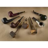 A mixed collection of estate pipes, four leather covered examples, two Longchamp, a Polo Sporting