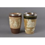 Two Doulton Lambeth beakers with silver mounted rims, one with applied Egyptian decoration, London