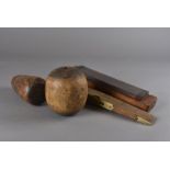 A collection of vintage wooden tools, including planishing hammers, woodcarving and other mallets,