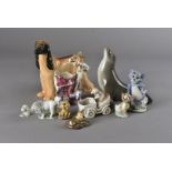 A collection of porcelain figurines, including a collection of Wade comprising Tom and Jerry and