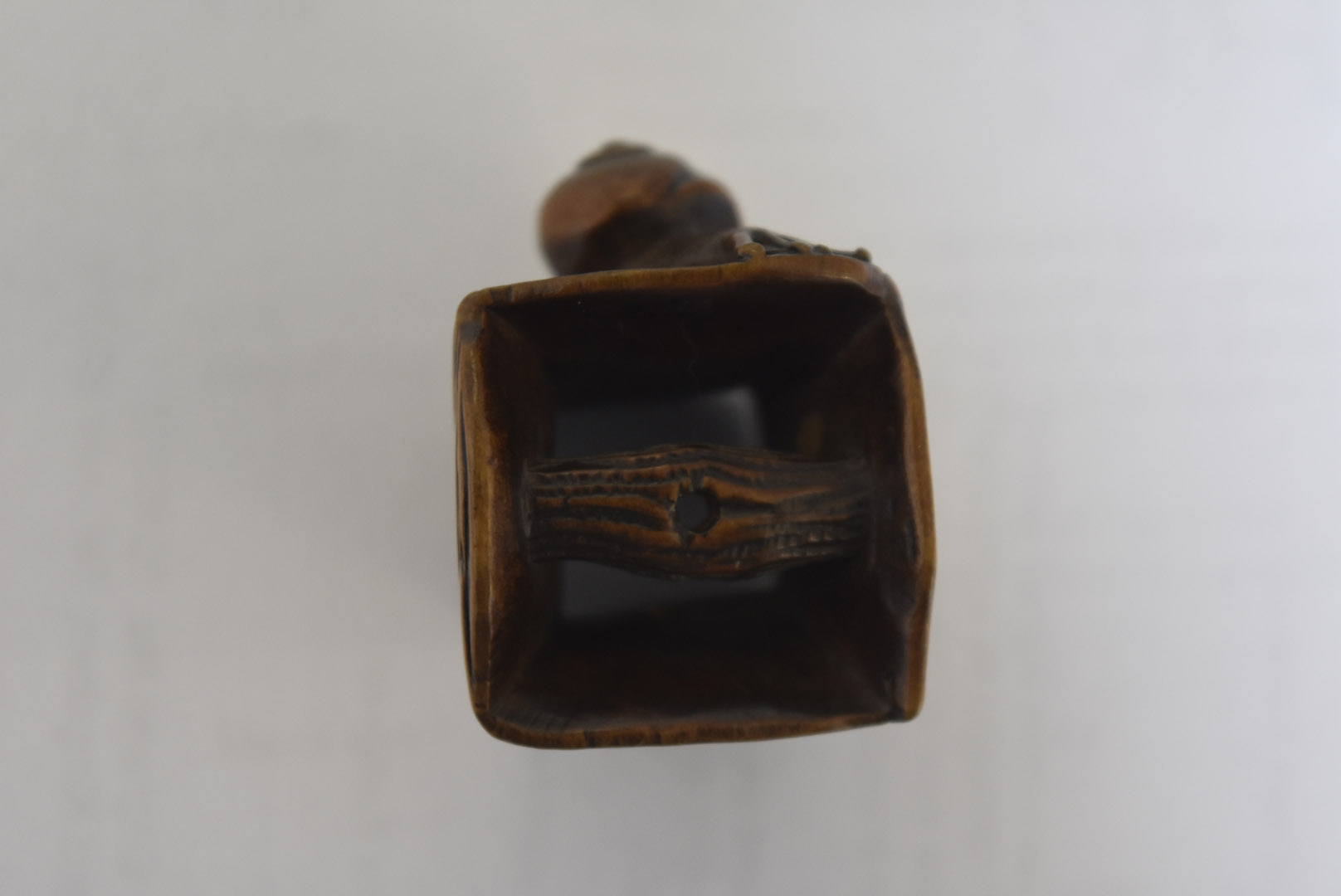 A Meiji period Japanese signed carved wood netsuke, modelled as a gong with large snail to one - Image 2 of 6