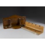 A Modern Dunhill four holed pipe rack, carved in Oak, together with an Art Deco oak and brass