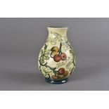 A modern Moorcroft ovoid vase, Bryony pattern, impressed, signed and dated to underside, 14 cm high,