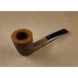 A Weiner briar estate pipe, the rusticated bowl with oval shank and tapered logo marked stem,