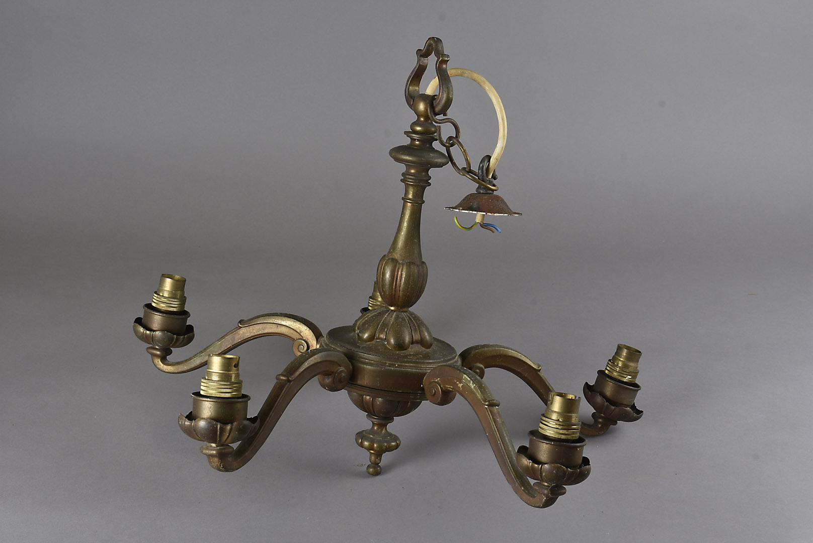 A brass electrolier, central sphere with six scroll arms, 59 cm X 44 cm together with another five