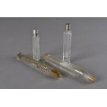 A group of four Victorian and later glass scent bottles, one with silver lid, Birrmingham 1899, plus