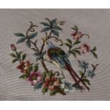 Four woolwork seat covers, two with exotic birds and flowers and two with floral sprays, the image