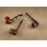 Three Italian estate briar pipes, including a Maurizio Calabash, with rusticated hand carved