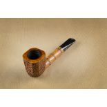 A Radice Rind briar estate pipe, the cushion shaped rusticated bowl, on a simulated bamboo shank,
