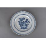 An 18th century English delft plate, decorated in cobalt blue in the bird and peony design,
