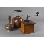 Three tin lined copper pans, one by Legry, a hand-cranked coffee grinder by Peugeot & Ci., a cased