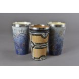 Three silver mounted Doulton Lambeth beakers, one by Elisa Simmance with mosaic style decoration