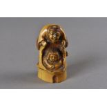 A Meiji period Japanese stained ivory netsuke, modelled as The Bamboo Princess Taketori, Hime and