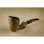 A Zetterwig briar estate pipe, the free hand with a flame grain, rusticated rim and hand cut logo