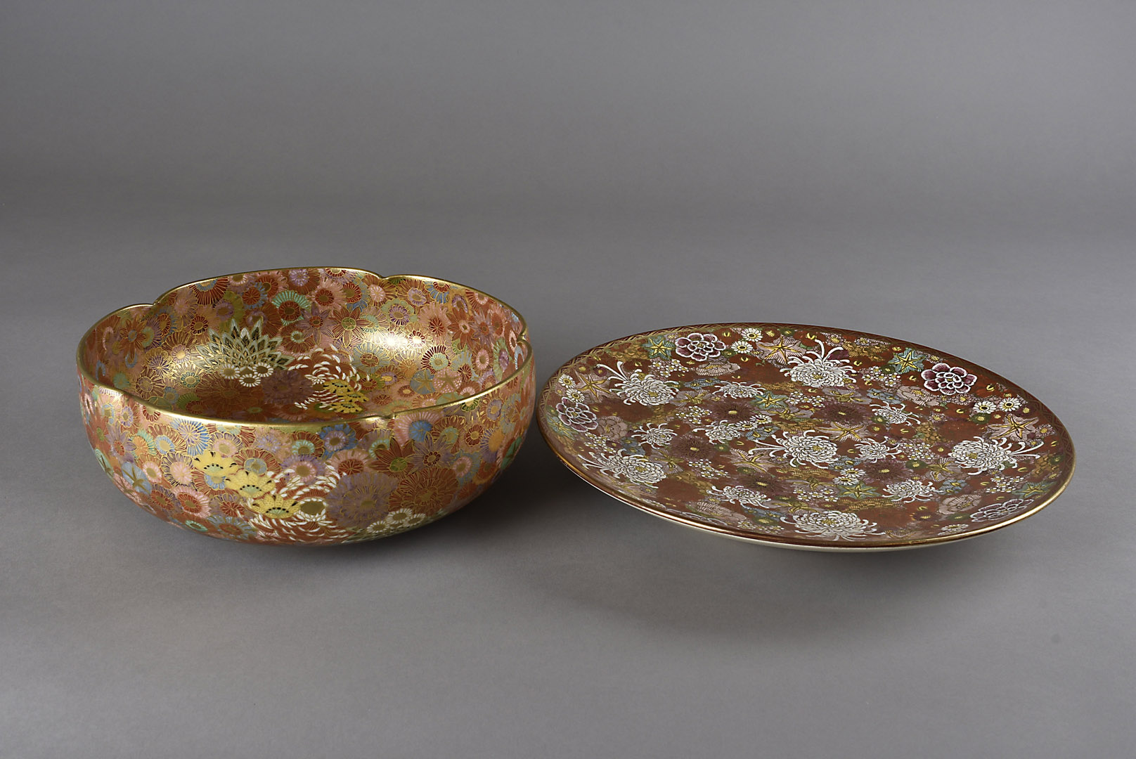 A Japanese Meiji period satsuma bowl, with crimped rim, with all over floral design heightened in