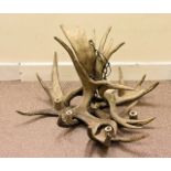 A large antler chandelier, thought to be late 20th Century, approx 90 cm diameter