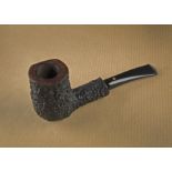 A Weiner briar estate pipe, the rusticated sitter, smooth rim, signed to underside, Weiner 10499