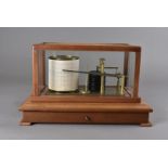 A cased barograph by Casella, with bevelled glass panels and paper drawer 37.5 cm W
