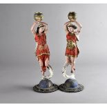 A pair of 19th Century spelter figural candlesticks, modelled as night and day on domed and