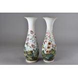 A pair of 19th Century white opaque glass vases, with all over floral decoration, one af, 36 cm high