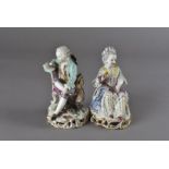 A pair of 19th Century Meissen figures, modelled as seated lady holding biscuit and gentleman