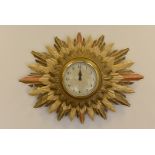 An early to mid-20th century Smiths Electric sunburst wall clock, having original electric movement,