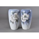 A near pair of Royal Copenhagen vases, decorated with hawthorn blossom to a graduated pale blue
