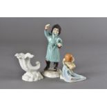 A Royal Worcester February figure, together with a Royal Worcester 'Little Mermaid', and a Royal