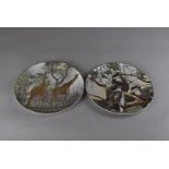 A pair of large 'African Serise' Royal Doulton platters, titled Zulu Warrior and Zulu Girl at